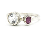 Round faceted white topaz ring in silver bezel setting and tiny ruby on sterling silver hammer texture band