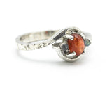 Oval sunstone ring with tiny labradorite side set gems in prongs setting with sterling silver texture band