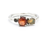 Sterling silver wedding ring with sunstone, opal and green tourmaline gemstone in bezel and prongs setting