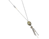 Oval green turquoise pendant necklace with silver flower and silver chain decoration