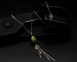 Oval green turquoise pendant necklace with silver flower and silver chain decoration