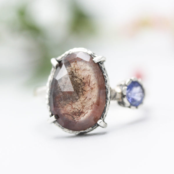 Teardrop faceted Moss agate ring with blue sapphire on the side on sterling silver hammer texture band