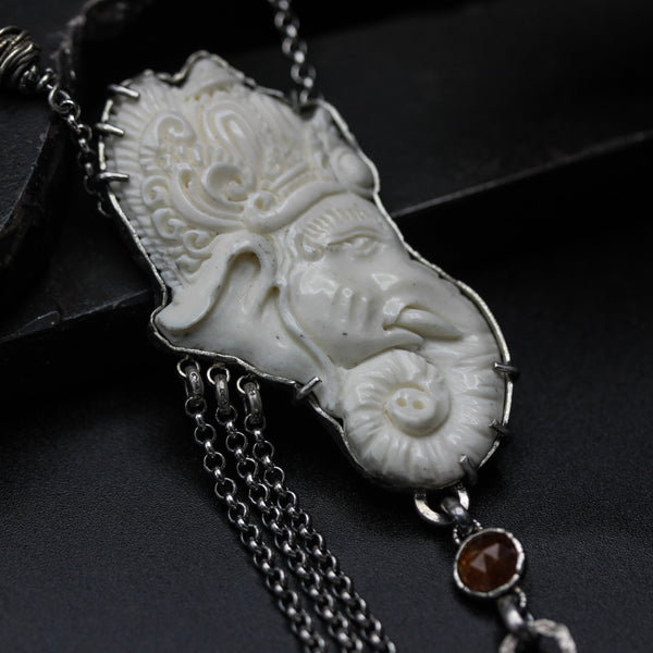 Hand Carved Bone Ganesha pendant necklace with orange kyanite and silver chain decoration