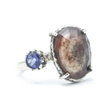 Teardrop faceted Moss agate ring with blue sapphire on the side on sterling silver hammer texture band
