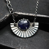 Blue sapphire pendant necklace in silver bezel and prongs with silver fan oxidized engraving on sterling silver chain