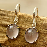 Oval cabochon Rose quartz earrings in silver bezel setting with polished brass accent prongs - Metal Studio Jewelry