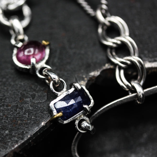Handcrafted bracelet blue sapphire with delicate pink sapphire accents on a sterling silver chain