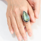 Teardrop Olive green Labradorite cocktail ring in silver bezel setting with sterling silver band