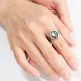 Oval cabochon Labradorite ring in bezel setting with silver texture oxidized thick band