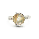 Round faceted golden rutilated quartz ring in silver bezel and prongs setting in sterling silver texture oxidized band