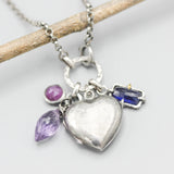 Silver heart locket necklace with blue sapphire, amethyst and pink sapphire on sterling silver chain