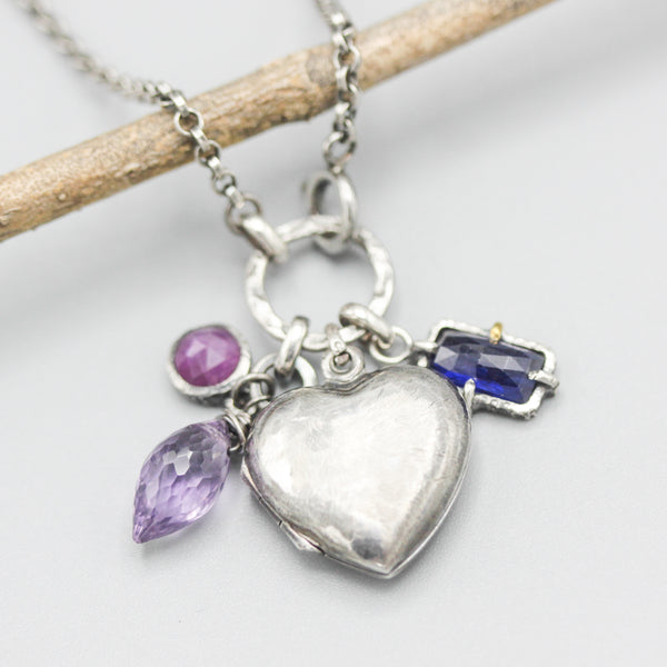 Silver heart locket necklace with blue sapphire, amethyst and pink sapphire on sterling silver chain