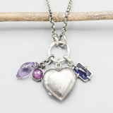 Silver heart locket necklace with blue sapphire, amethyst and pink sapphire on sterling silver chain