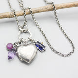 Silver heart locket necklace with blue sapphire, amethyst and pink sapphire on sterling silver chain