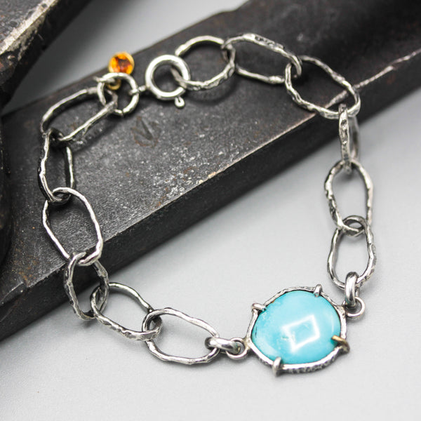 Bracelet Arizona turquoise and orange sapphire decoration with hoop hard texture oxidized sterling silver chain.