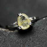 Teardrop faceted golden rutilated quartz ring in silver bezel and prongs setting in sterling silver hammer texture oxidized band