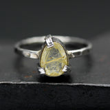 Teardrop faceted golden rutilated quartz ring in silver bezel and prongs setting in sterling silver hammer texture oxidized band