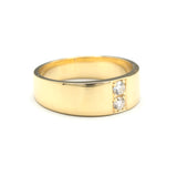 Men's ring in 18k gold featuring a high-polished band with 2 round faceted diamonds.