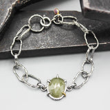 Bracelet oval faceted gray sapphire and Ruby decoration with hoop hard texture oxidized sterling silver chain