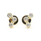 18k gold stud earrings featuring three round diamonds in a bezel setting