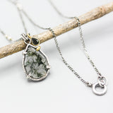 Teardrop Moss agate pendant necklace in silver bezel and prongs setting with sapphire on sterling silver chain