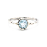 Round blue topaz ring in silver bezel setting with sterling silver hammered texture band