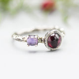 Round Garnet ring and Amethyst with oxidized sterling silver hard texture band