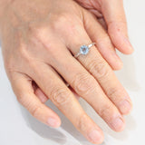 Round blue topaz ring in silver bezel setting with sterling silver hammered texture band