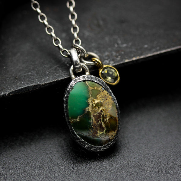 Oval turquoise pendant necklace in silver bezel setting with green multi-sapphire gemstone