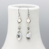 Round white Freshwater Pearls earrings in silver bezel setting with silver leaf on sterling silver hooks style