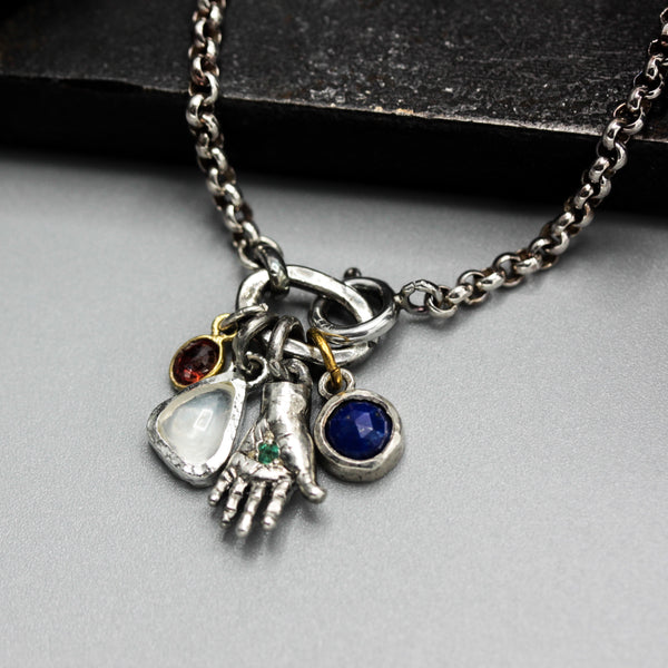Sterling silver bracelet with Emerald in silver hand shape with Lapis lazuli, Moonstone and red sapphire gemstone