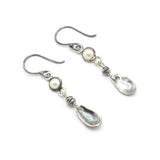 Round white Freshwater Pearls earrings in silver bezel setting with silver leaf on sterling silver hooks style