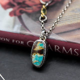 Oval Turquoise pendant necklace in silver bezel setting with sterling silver chain