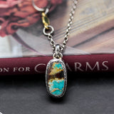 Oval Turquoise pendant necklace in silver bezel setting with sterling silver chain