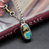 Oval Turquoise pendant necklace in silver bezel setting with sterling silver chain