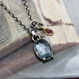 Oval faceted mint kyanite pendant necklace in silver bezel and prongs setting