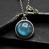 Round cabochon Labradorite pendant necklace in silver bezel setting with green multi sapphire gemstone