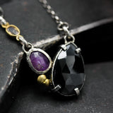 Teardrop black onyx necklace with pink sapphire in silver bezel and prongs setting