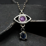 Silver Evil eyes pendant necklace with pink sapphire and blue kyanite gemstone on sterling silver chain