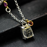 Golden rutilated quartz pendant necklace in silver bezel and prongs setting with sterling silver chain