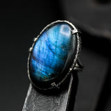 Oval cabochon blue Labradorite cocktail ring in silver bezel and prongs setting with sterling silver band