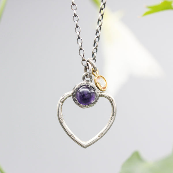 Round Amethyst gemstone necklace in silver bezel setting with silver heart shape and oxidized sterling silver chain