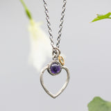 Round Amethyst gemstone necklace in silver bezel setting with silver heart shape and oxidized sterling silver chain