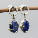 Oval fceted Lapis Lazuli earrings in silver bezel and prongs setting with circle loop on sterling silver stud style