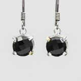 Round faceted black onyx earrings in silver bezel and prongs setting on sterling silver hooks style