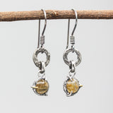 Rutilated quartz earrings in silver bezel and prongs setting with silver texture circle loop on hooks style