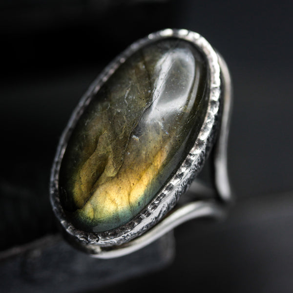 Oval olive green natural Labradorite cocktail ring in silver bezel setting with sterling silver band