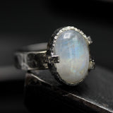 Oval Moonstone ring in silver bezel and prongs setting with silver band