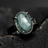 Mint kyanite ring in silver bezel and prongs setting with sterling silver texture flat design band