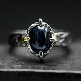 Oval cabochon blue kyanite ring in silver bezel and 4 prong setting with sterling silver texture design band
